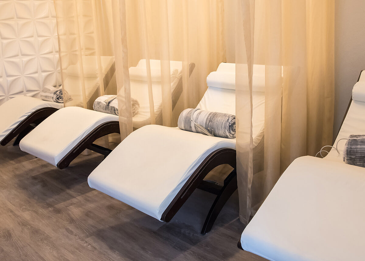 Relaxation lounge with row of loungers and soft drapery