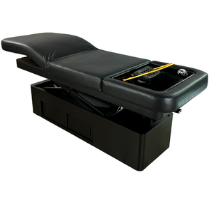 Black massage table with storage compartment on a white background