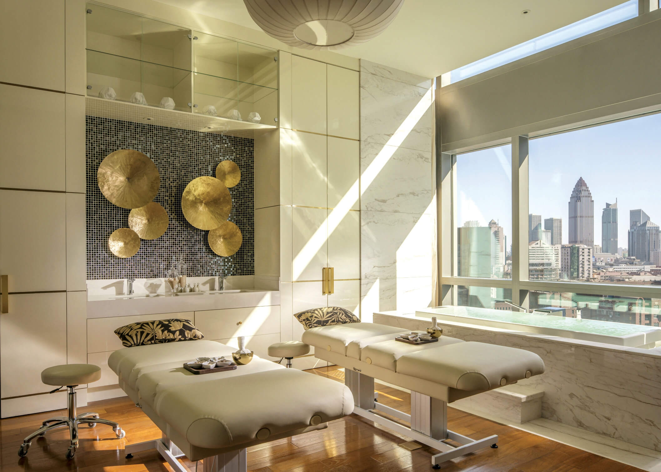 Luxury treatment room with TouchAmerica table and city skyline view